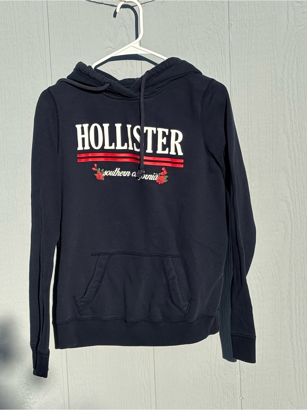 Hollister Navy Pullover Hoodie with Red and White Logo
